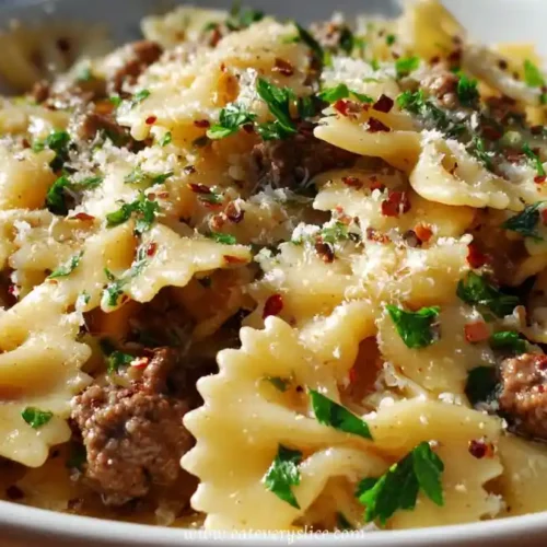 Bowtie pasta with garlic butter, ground beef, parsley, red pepper flakes and parmesan