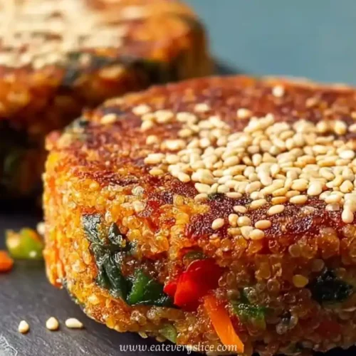 Crispy lobia and vegetable kebabs topped with sesame seeds on slate serving board
