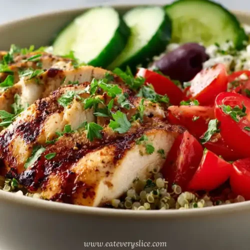 grilled chicken with quinoa, tomatoes, cucumber, olives, and feta in Mediterranean bowl