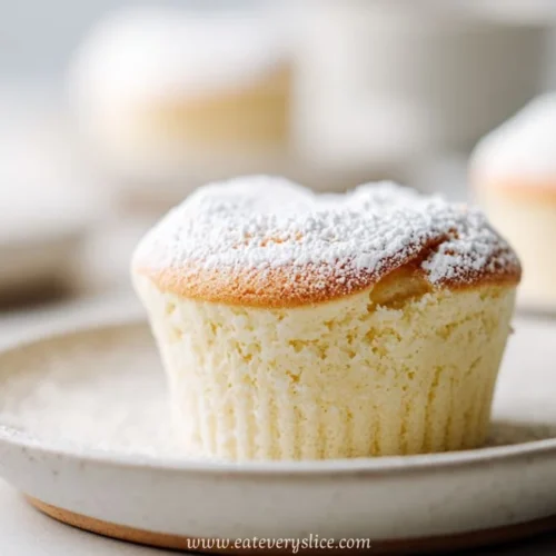 fluffy japanese cotton cheesecake cupcake topped with powdered sugar