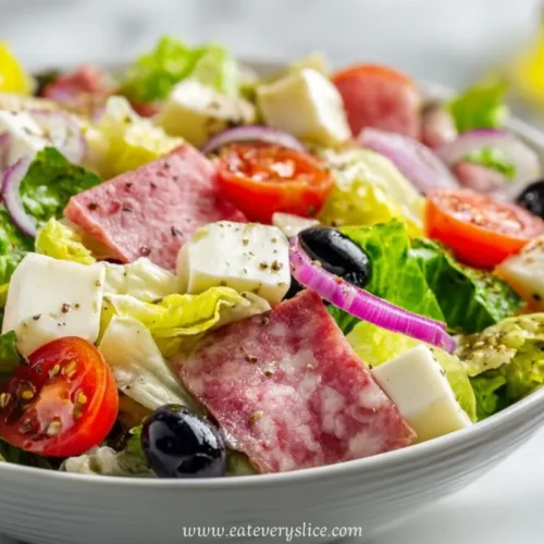 italian salad with salami feta cheese olives cherry tomatoes and lettuce